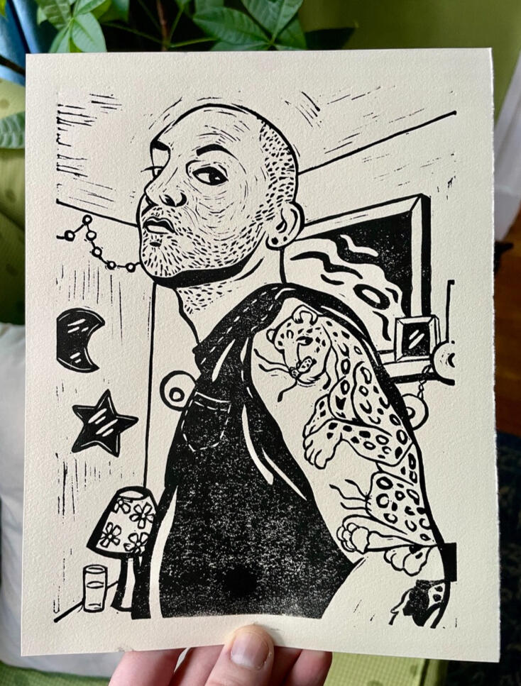 Adam Linocut print of a man with a shaved head, beard stubble, and a large leopard bicep tattoo.